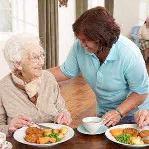Carer Feeding an Elderly Resident